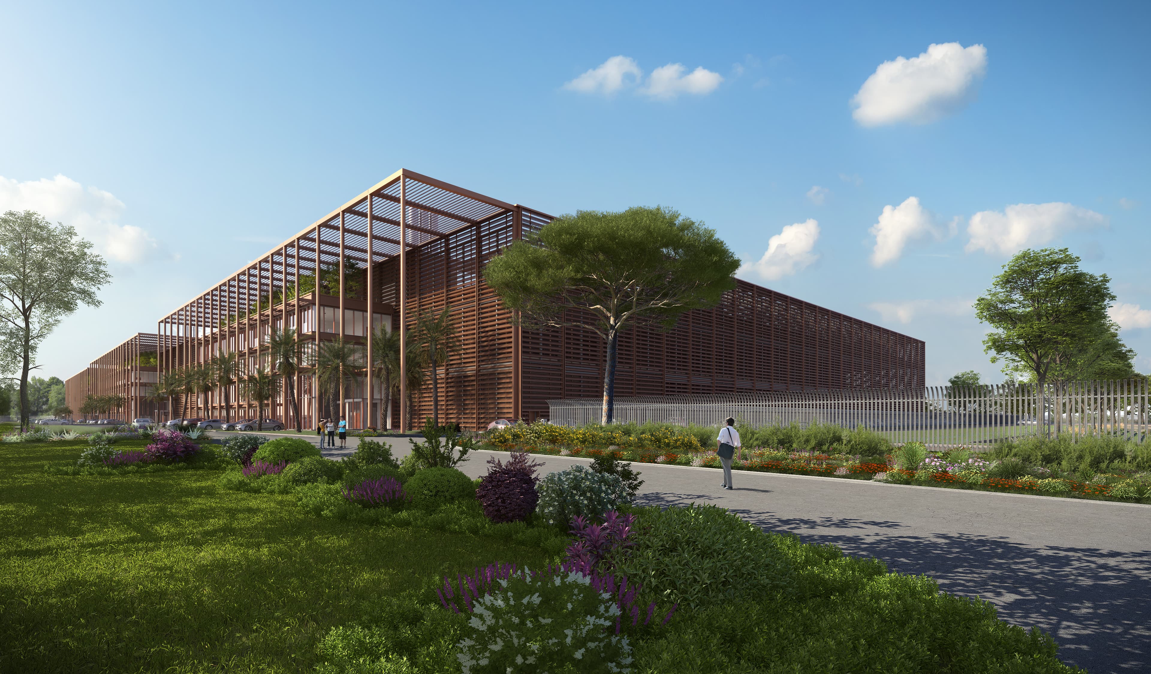 Vue depuis l'entrée du complexe de data centers, avec écran brise-soleil en lattes de bois et aménagement paysager au premier plan.
